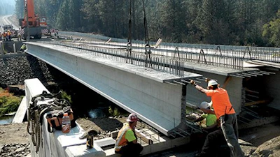 136.8-ft.-long prestressed concrete super girders for the new Miles Creston Bridge in Lincoln County, Wash., are 58 in. tall with 49-in.-wide top flanges to maximize span length, minimize the number of girders and allow clearance above the river for a 100-year flood.