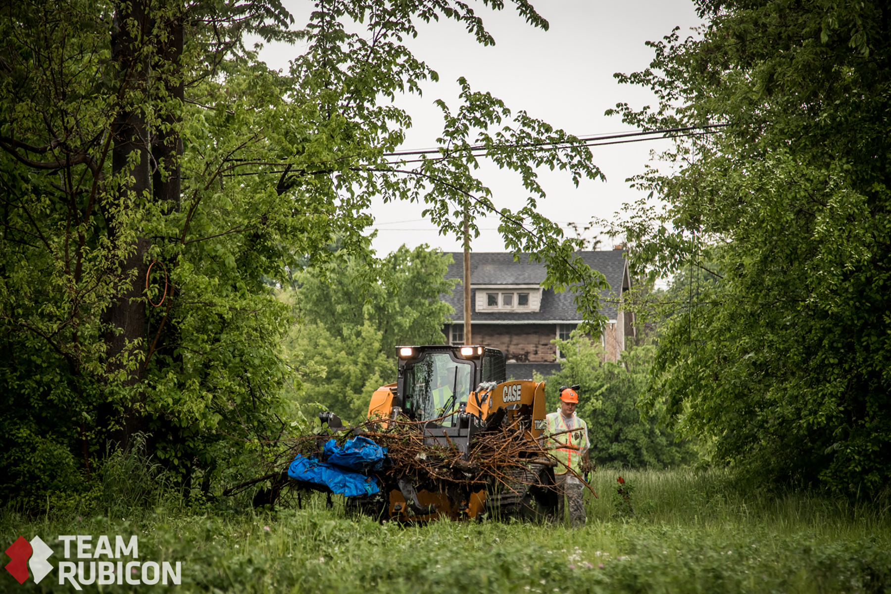 The CASE TR310 CTLs were used in debris management initiatives during the project, including the removal of fallen or dangerous trees, trash, overgrowth and the consolidation of debris and refuse, as well as the demolition of several garages and other outbuildings.