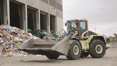 Volvo CE's LX1 prototype electric hybrid wheel loader at Waste Management's Moreno Valley Transfer Station. The LX1 is a series hybrid, which puts an electric motor at each wheel and replaces an equivalent-sized conventional loader's 13L engine with a 3.6L diesel, on board strictly to run the loader's generator. Volvo says 98% of the components on the LX1 are new.