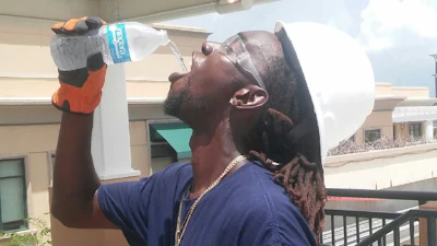 Western Worker Staying Hydrated In Heat 596e7ab511d95