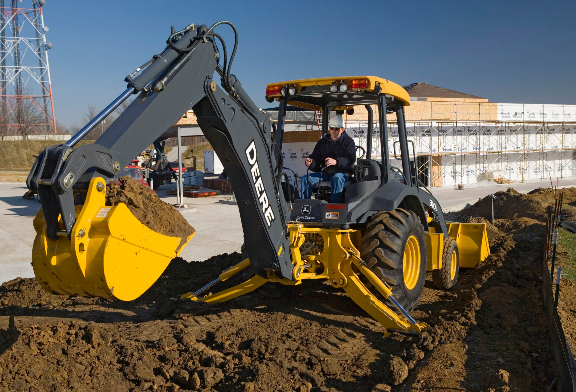 To prevent the backhoe from rocking or tipping while digging, always use the stabilizers.