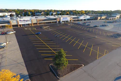 Initially the job was a mill and fill project. Asphalt Contractors had intended to just do a small patch but the inspector read the plans and determined the entire parking lot had to be milled, paved and striped before the stores could open.