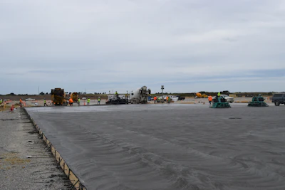 Figure 1: Large slab on grade placement utilizing truck dump and laser screed strike-off.