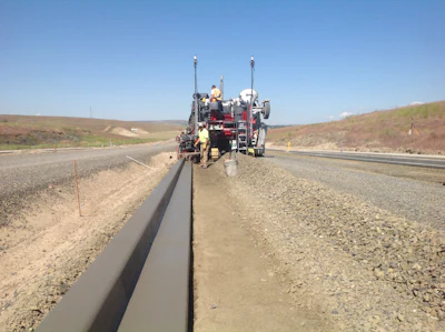 Using the Wirtgen curb and gutter machine with Trimble PCS900 paving control system and a SPS930 universal total station helped Wm. Winkler's team cut about two weeks off a two-month WDOT project.
