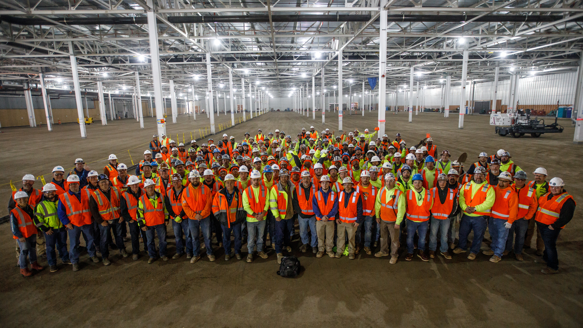 Tradesmen from Barton Malow, Lloyd Concrete Services, Unlimited Concrete Solutions and partners pose prior to embarking on the epic Mega Slab project.