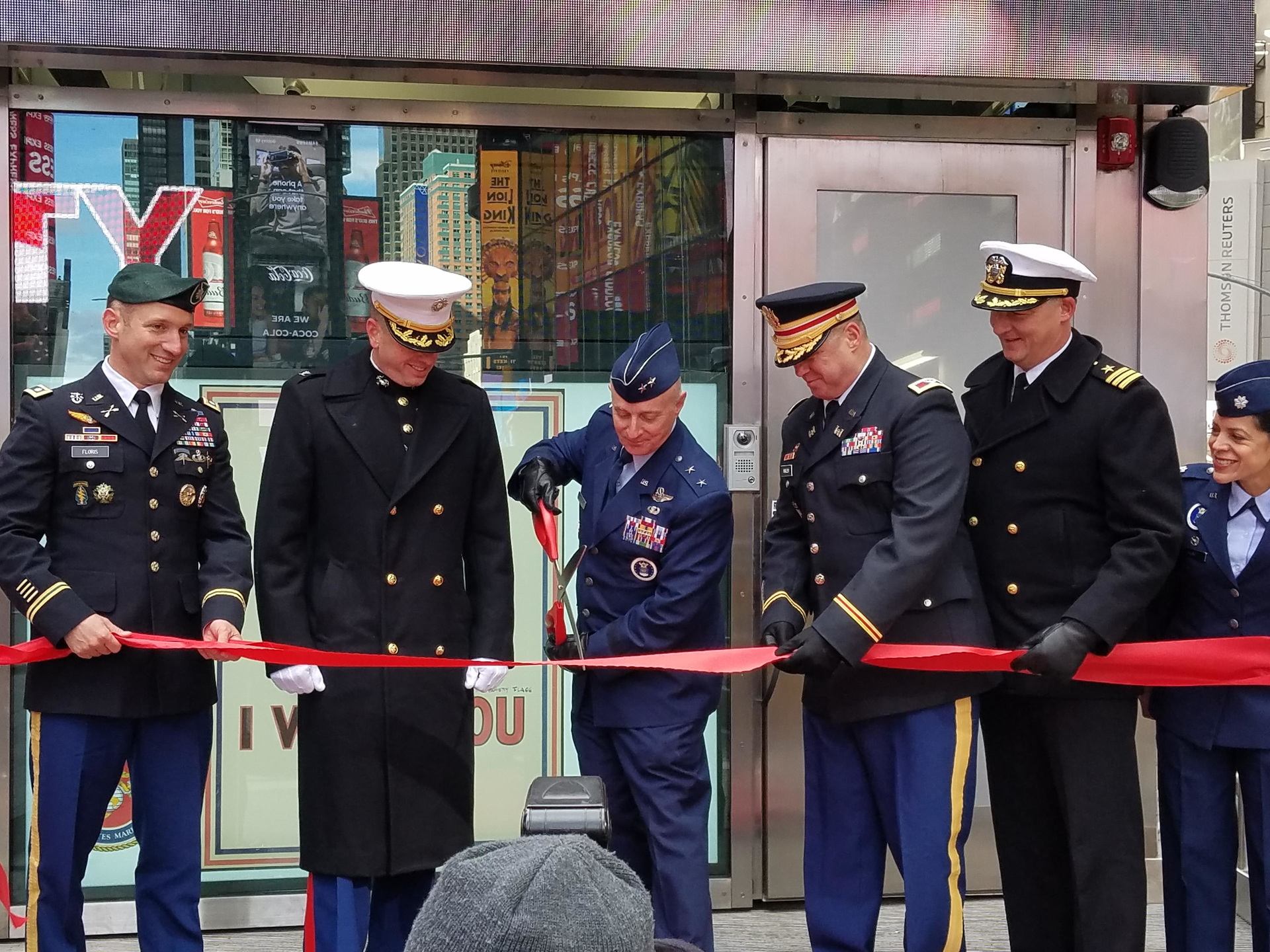 Cutting the ribbon to open the Times Square recruiting station.