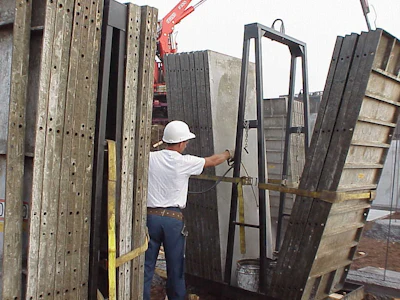 A crane delivers forms to the jobsite.