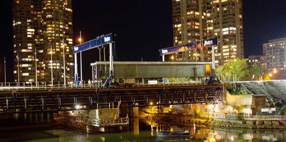 To prevent overloading the partly deconstructed, 100-year-old bridge, Western Mechanical laid gantry track system independent of the bridge itself, requiring a 79-ft.-long header beam.