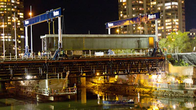 To prevent overloading the partly deconstructed, 100-year-old bridge, Western Mechanical laid gantry track system independent of the bridge itself, requiring a 79-ft.-long header beam.