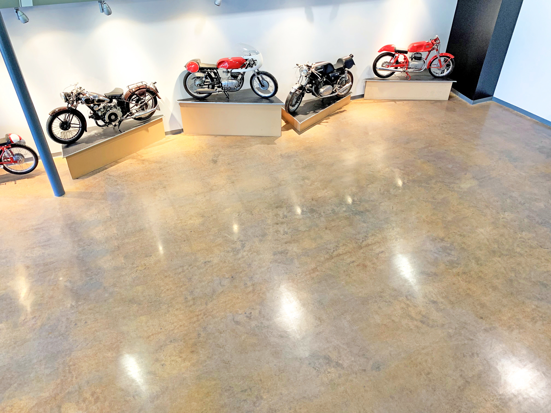 Layers of paint, epoxy, carpeting, luxury vinyl tile and vinyl composite tile once covered the floor at the Moto Museum in St. Louis, which houses some of the rarest motorcycles in the existence.