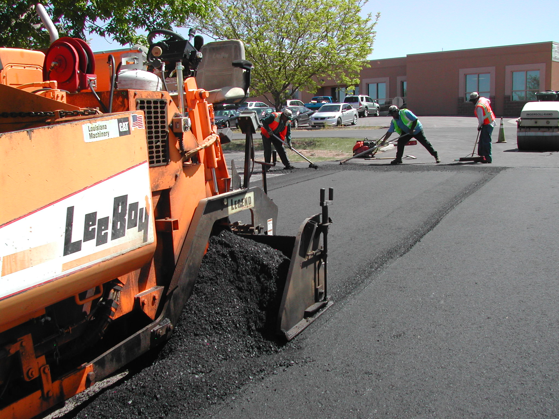 If the proper amount of mix is placed in the proper place, no raking of the mix at the longitudinal joint is necessary.