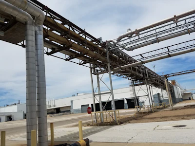 In addition to the flooring, fireproofing, walls and ceilings that required abatement within the interior of the buildings, thousands of feet in asbestos-insulated piping was removed from tunnels and pipe racks that connected each building.