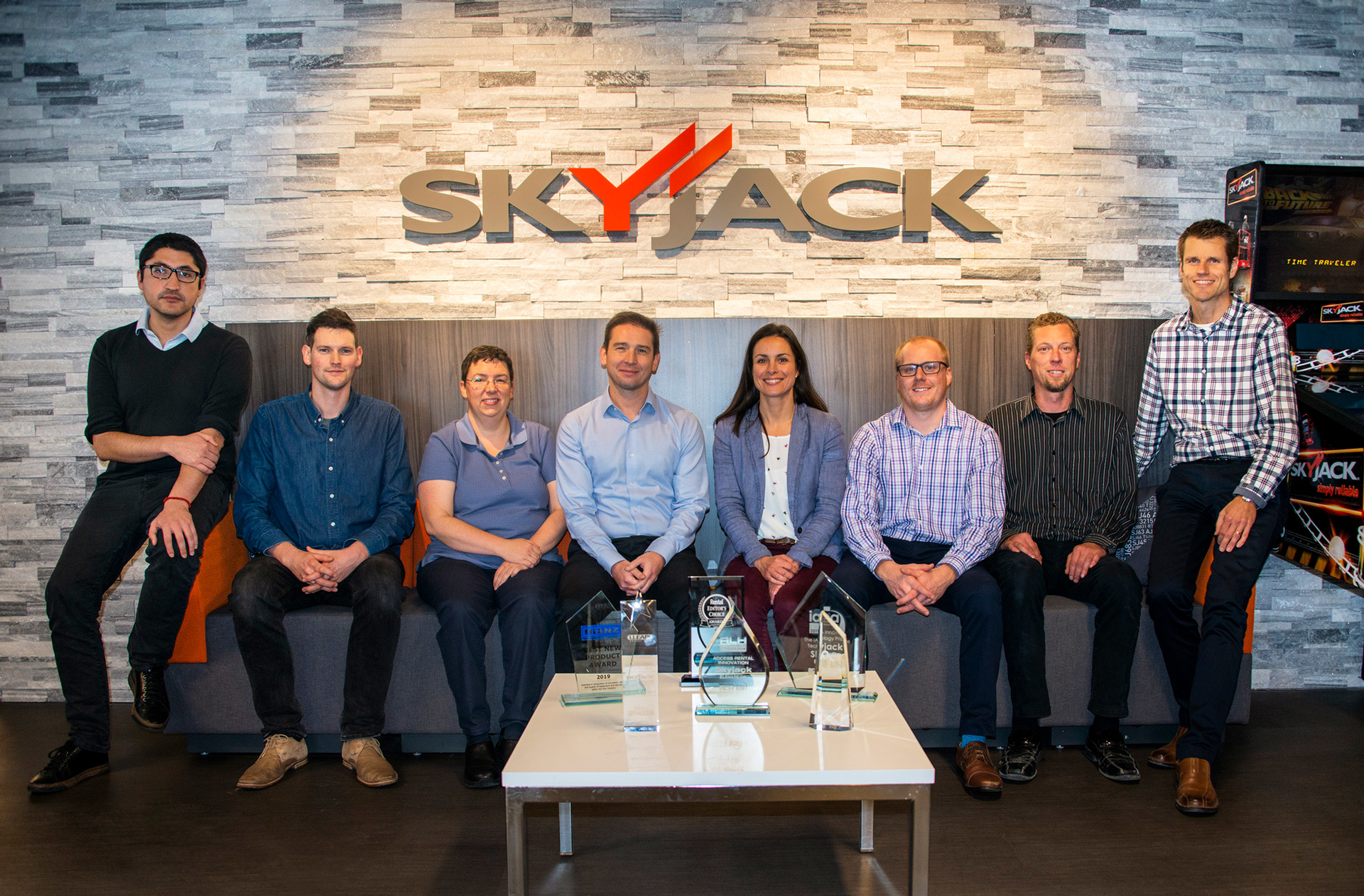 Skyjack team poses with awards won from solutions like ELEVATE