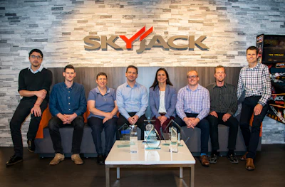 Skyjack team poses with awards won from solutions like ELEVATE