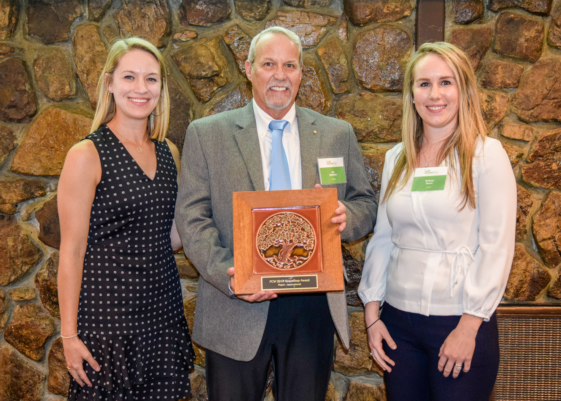 Jim Whitfield, MAPEI Corporation’s Director of Technical Services, and Brittany Storm, MAPEI Corporation’s Sustainabaility Manager, receiving the award.