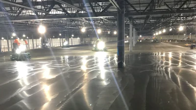 Warehouse slab on metal deck finishing process.