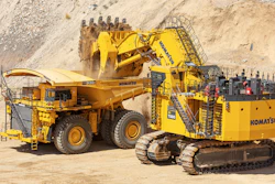 A Komatsu AHS truck and hydraulic excavator work together at the Komatsu Proving Grounds in Arizona.
