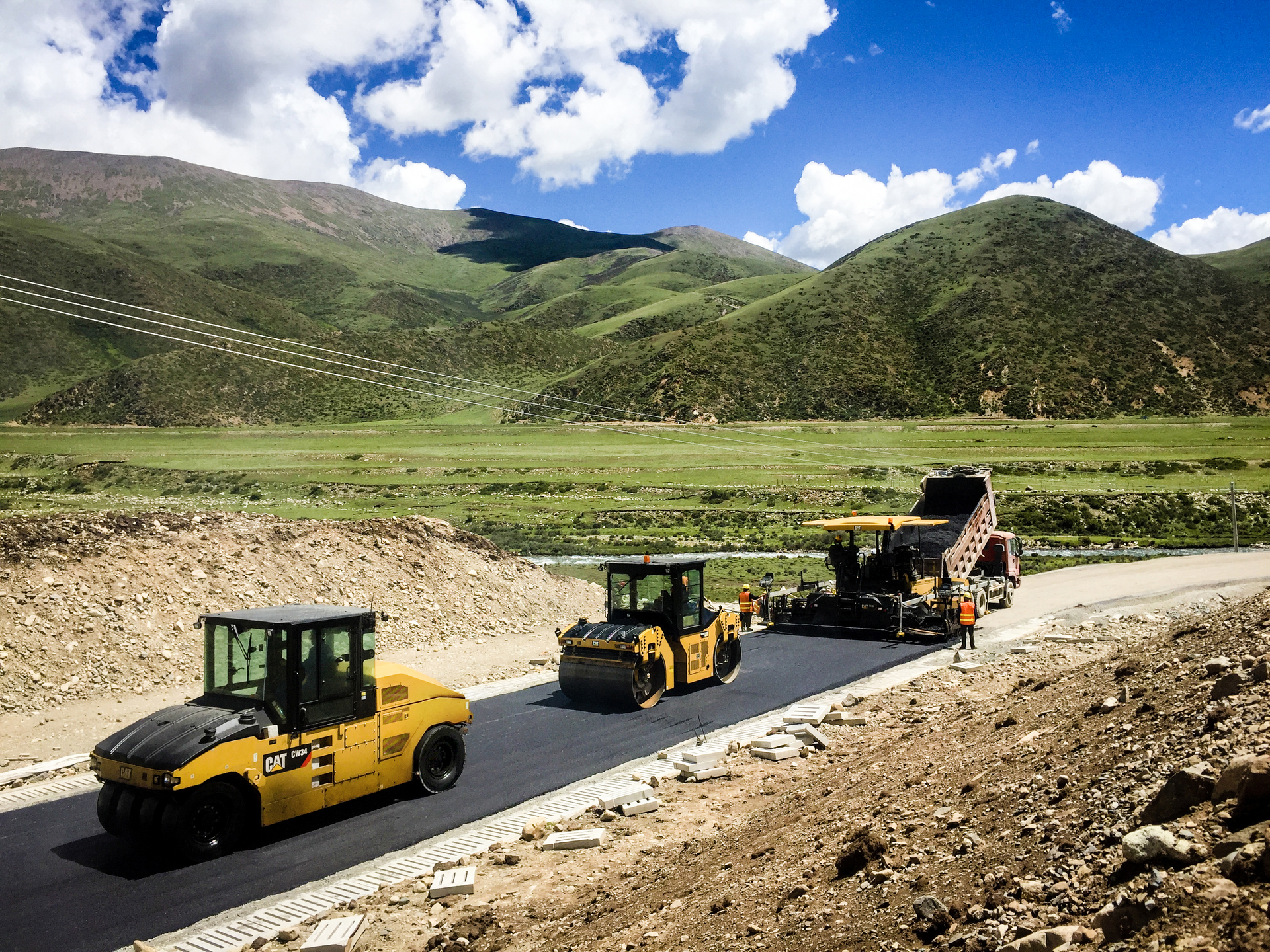 Pneumatic rollers are typically used in an intermediate roller position in an asphalt paving train, and are well suited for obtaining compaction in the tender zone.