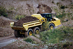 With an ejector truck, because you’re pushing material out the back of the truck, if you do happen to be in some wet and sticky material, you’ve eliminated your carryback.
