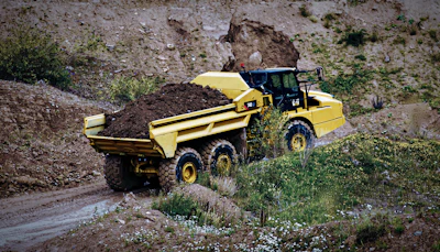 With an ejector truck, because you’re pushing material out the back of the truck, if you do happen to be in some wet and sticky material, you’ve eliminated your carryback.