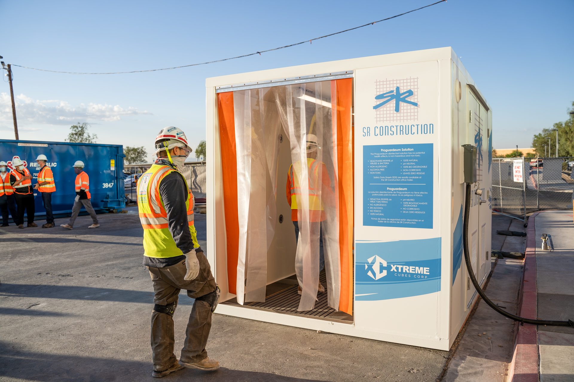 SR Construction employees walk through the Xtreme Opti-Clean Cube.