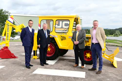 Shown with the restored 1964 JCB 1 backhoe (from left to right): George Bamford, Sir Anthony Bamford, Roland Carnaby Sr. and Roland Carnaby Jr.