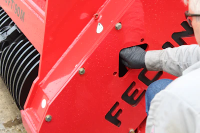 A belt inspection cover allows for easily checking the condition and tension of the belt.