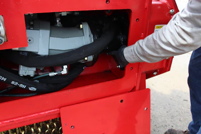 During the daily inspection, always look at the hydraulic motor area for leaks in the attached hoses and fittings and to ensure the area remains clean and free of debris.