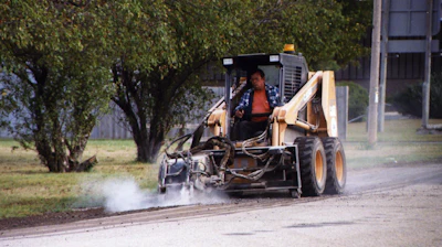 Cold planer attachments enable a skid steer to cut and mill both concrete and asphalt in controlled increments.