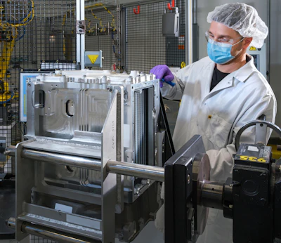 General Motors Fuel Cell Controls and Process Engineer Joe Truchan builds a fuel cell stack at the GM Global Propulsion Systems Pontiac Engineering Center in Pontiac, MI.