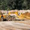 Summit utilized two Volvo 40-ton articulated dump trucks pulling K-Tec 1237ADT scrapers (such as shown) in a train configuration on the long haul from the east spoil pile.