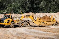 Summit utilized two Volvo 40-ton articulated dump trucks pulling K-Tec 1237ADT scrapers (such as shown) in a train configuration on the long haul from the east spoil pile.