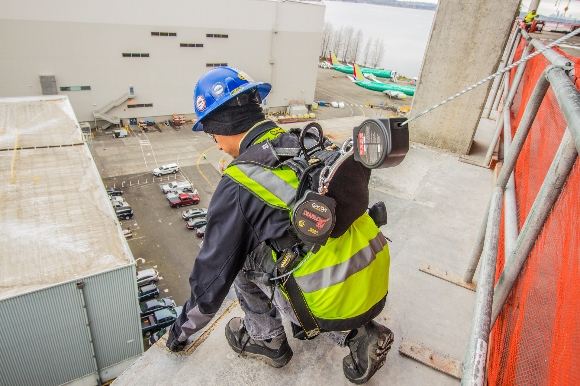 A harness/lanyard does not prevent a fall, but rather stops the wearer from reaching the ground in the event a fall occurs.