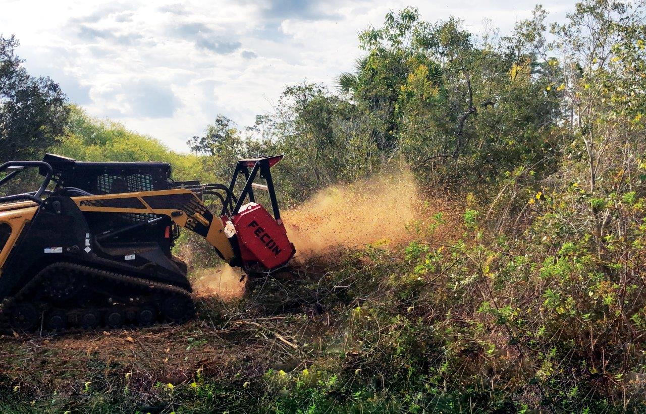 Randy R. Mitchem, Inc. is using a Fecon BLACKHAWK mulcher head such as the one shown to complete a variety of land clearing projects.