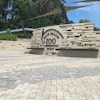 To create the pattern and control water runoff at the same time, Singer Studio chose Eco-Holland permeable pavers in Napoli and Aragon colors from Belgard.