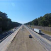 Crews have utilized a temporary access ramp beside the Garner plant that runs from a closed bridge to help bypass traffic and haul asphalt right down into the median. A temporary road built adjacent to the plant provides access to the outside shoulder in the westbound direction. This system will save the team from having to haul approximately 24,500 loads of asphalt in traffic during the project.