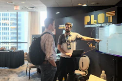 Jobsite logistics startup Plot exhibits at Advancing Construction Technology 2022. Here, Founder and CEO Chris Callen connects with an attendee.