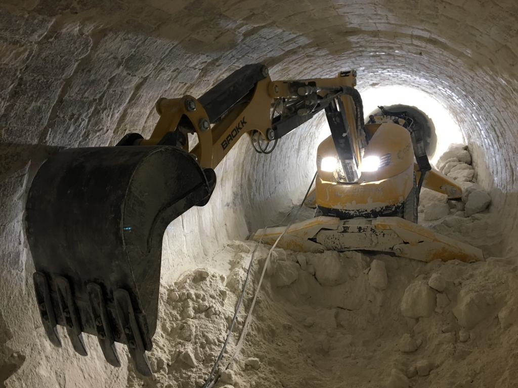 Demolition robots can be paired with a bucket to increase efficiency for a number of confined applications such as excavation, digging trenches, material handling, sorting, separating and loading debris.