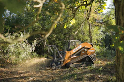 The CASE TV620B tackles a mulching task on soft ground in a heavily wooded area.