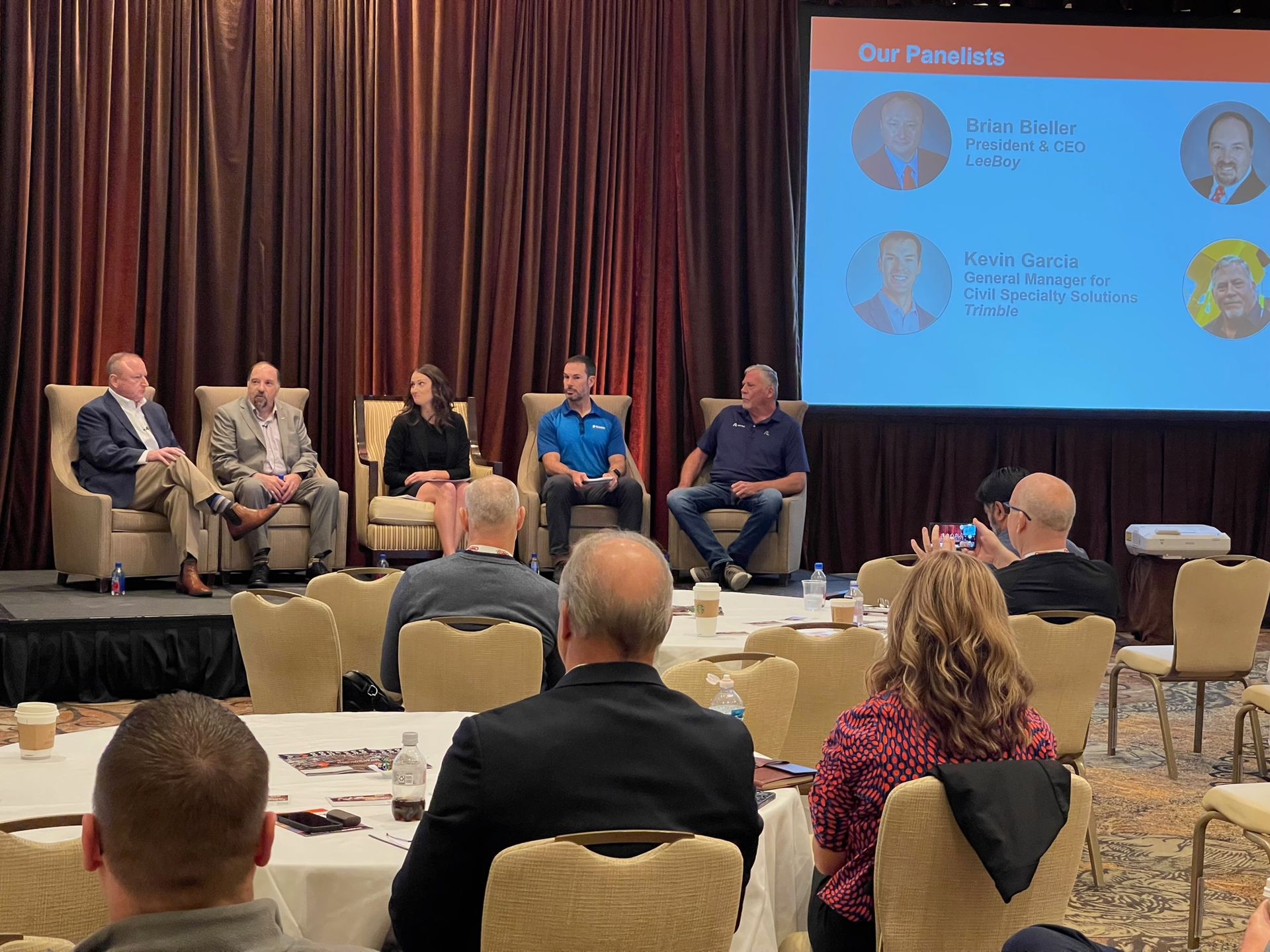 A panel about the 2023 industry trends moderated by AEM's Sara Feuling, Senior Director of Construction.