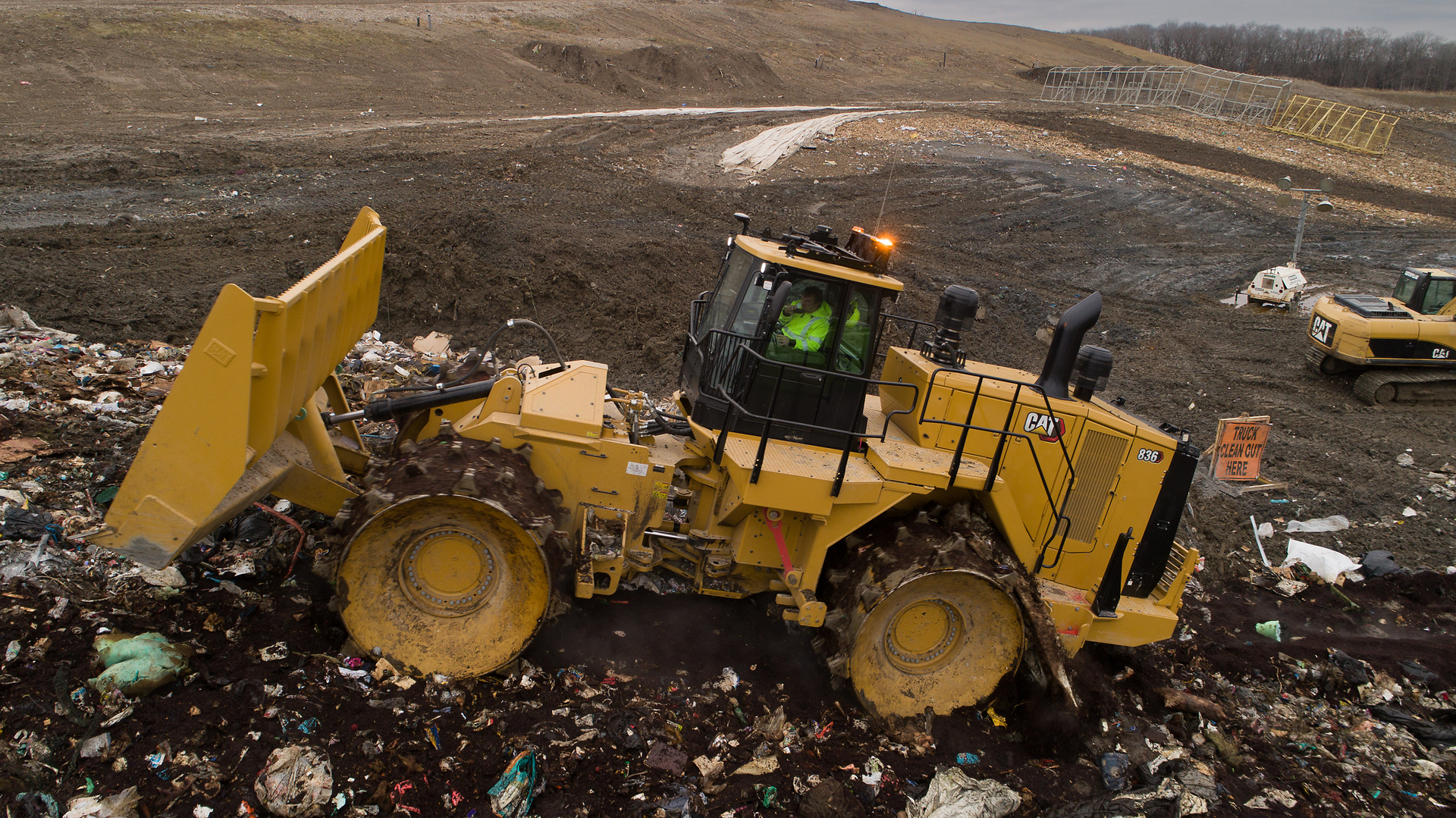 The system includes a global navigation satellite system (GNSS) receiver on top of the 836 and mapping display inside the cab.