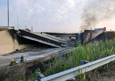 This image provided by the Office of Emergency Management shows firefighters standing near the collapsed part of I-95 in Philadelphia, Sunday, June 11, 2023.