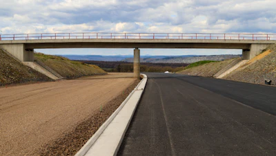 When installing road base, it must be spread over the subgrade to the required thickness. Then, the materials are compacted using a special machine, such as a roller or compactor.