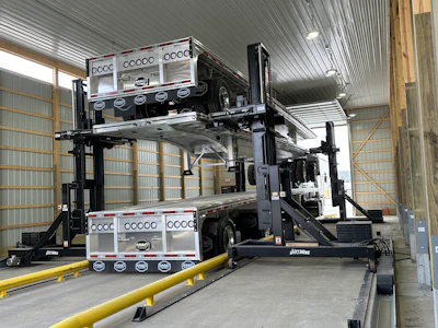 The stacking system requires just one person to operate without the need for special rigging, slings or climbing onto the trailers.