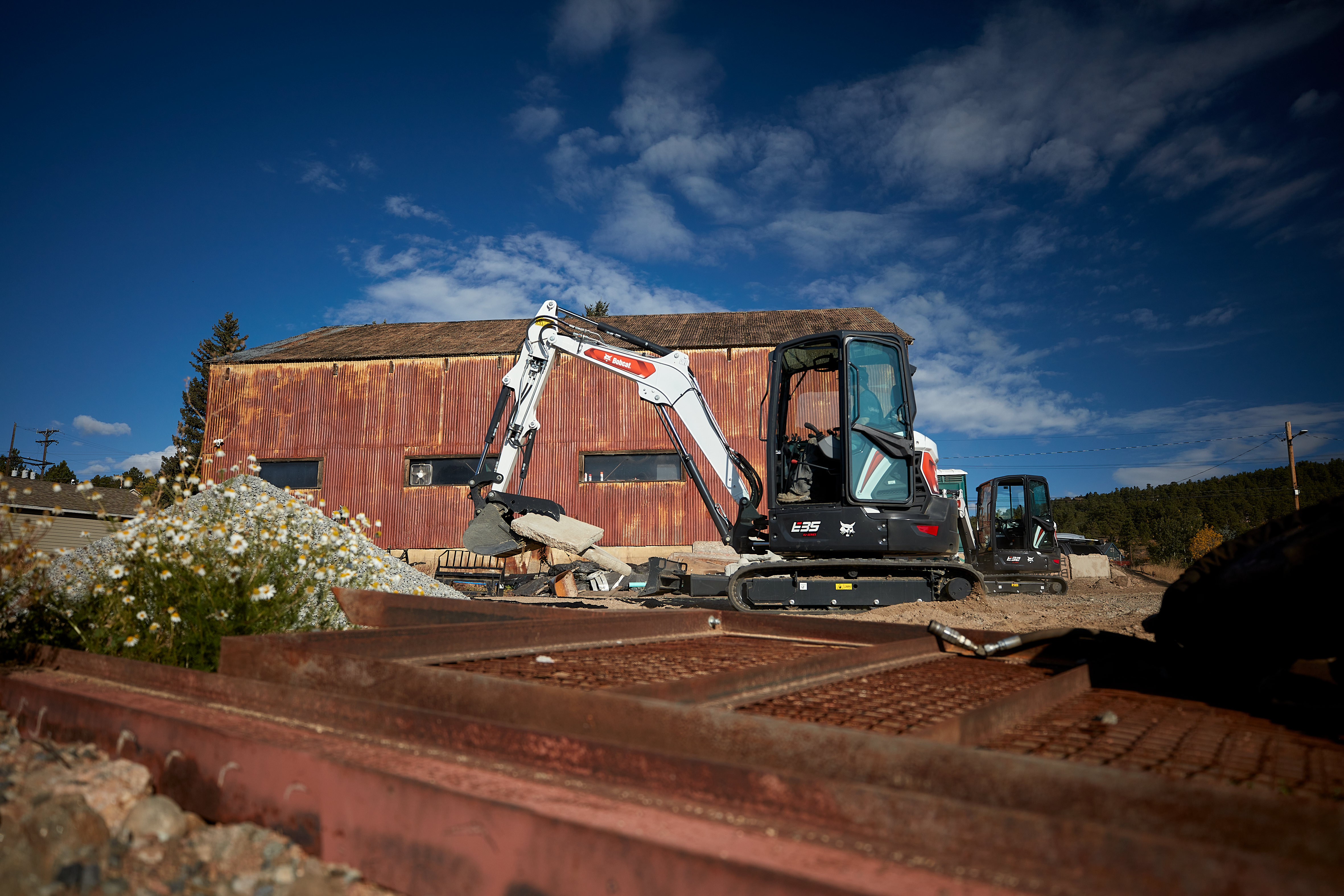 Mini excavators are ideal for clearing, grading and applying fill material to prep pathways with minimal disruption.