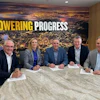 Executives from CRH sign the agreement with Caterpillar Group President Denise Johnson at the company’s headquarters in Irving, Texas.