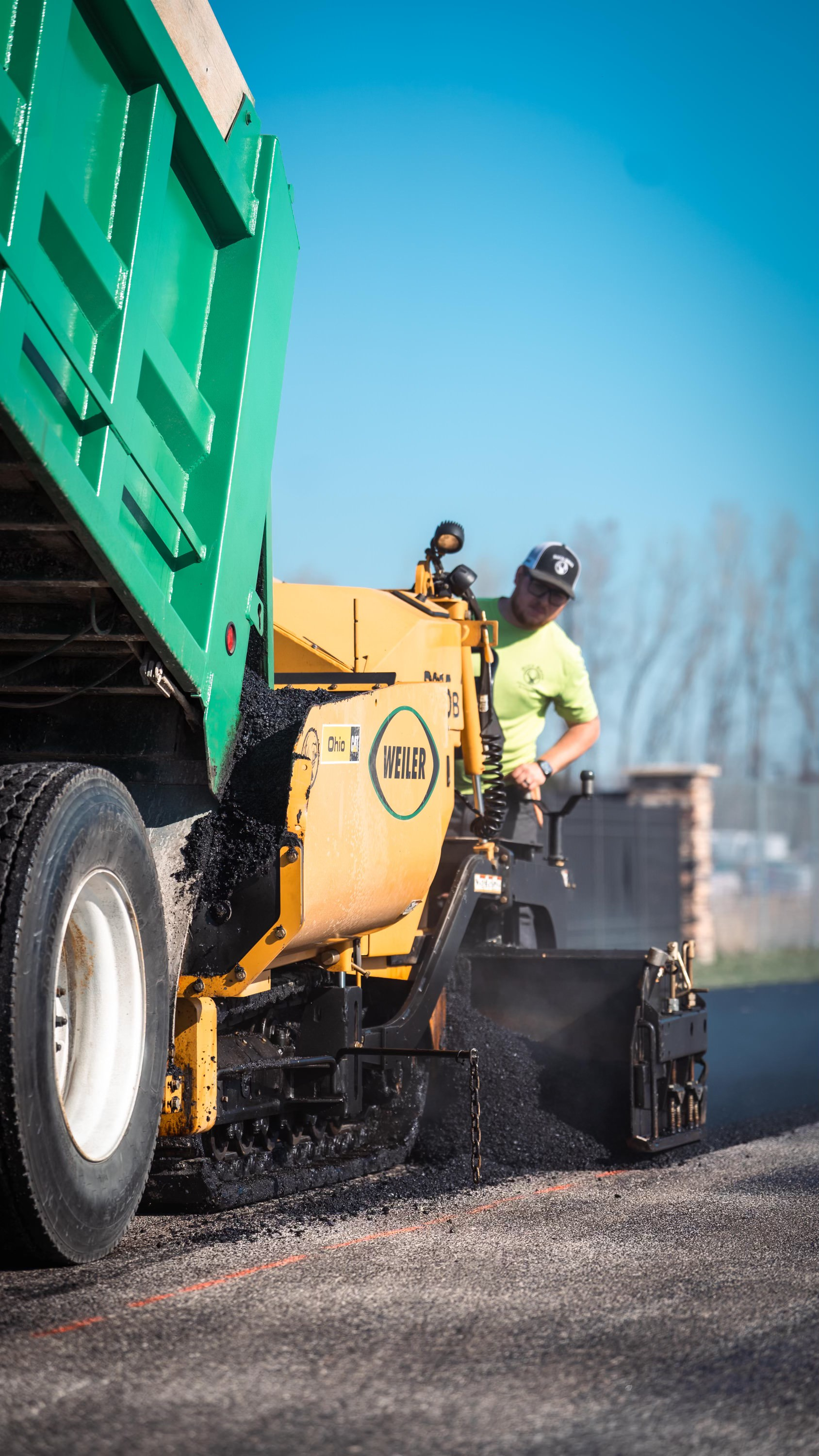 Zach Buck running the paver for Buck Brothers