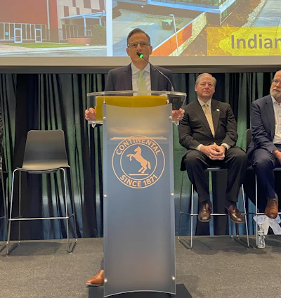 Etzel gives opening remarks during the open house.