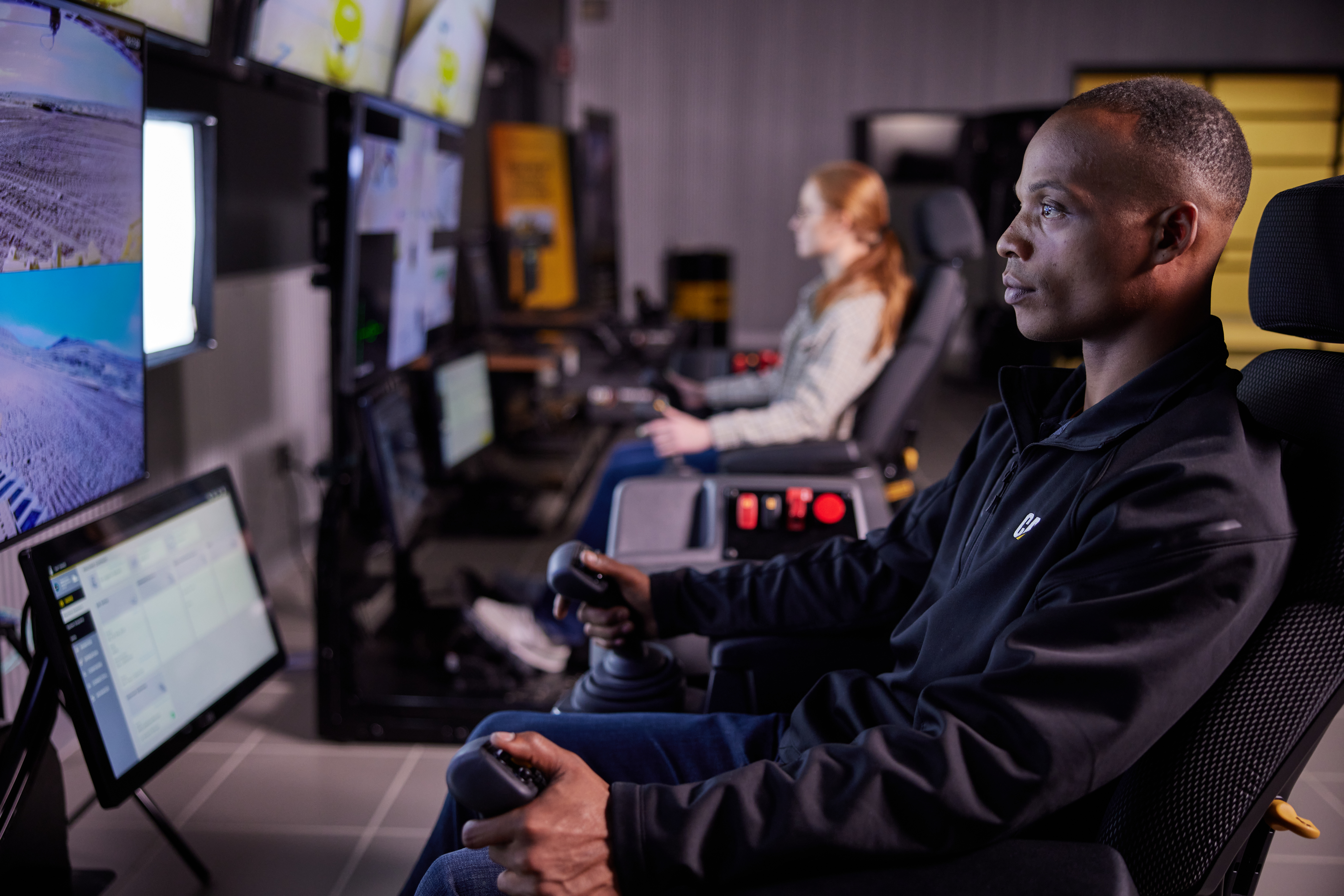 Remote control is also used when performing grading operations under Stage 3 conditions. In this instance, the operator is not on board the vehicle but operating it from a separate location using a joystick or belly box.