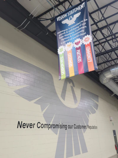 Amerequip's vision statement banner and mission statement are mounted in the manufacturing facility for all employees and customers to see.